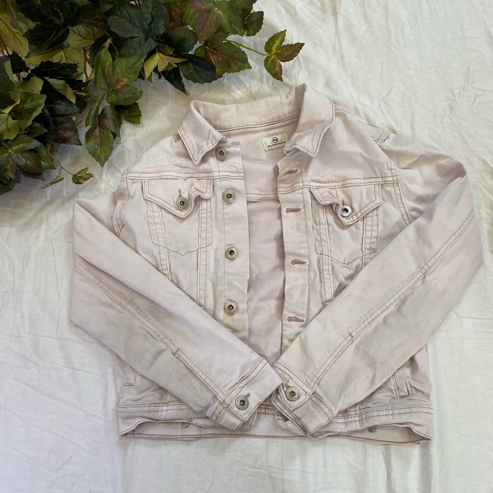 Light pink denim jacket.